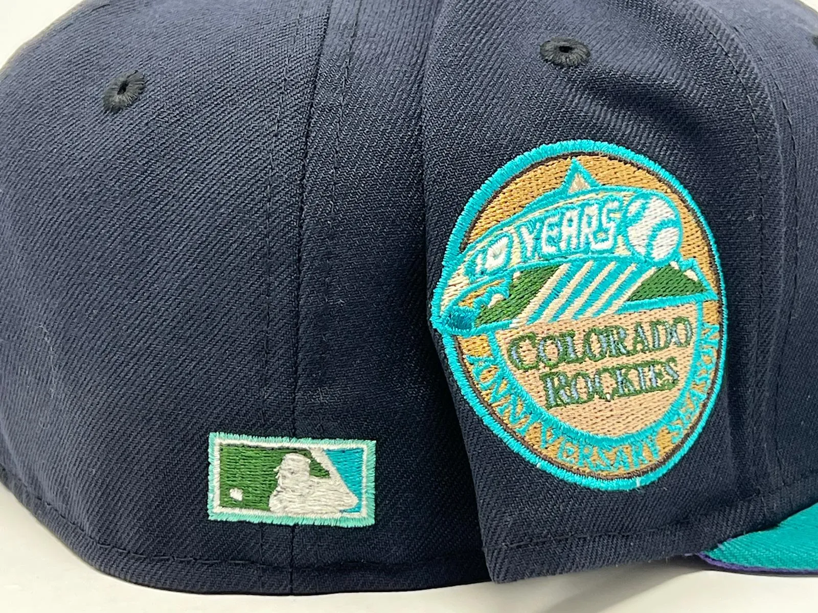 COLORADO ROCKIES 10TH ANNIVERSARY NAVY AQUA PURPLE BRIM NEW ERA FITTED HAT